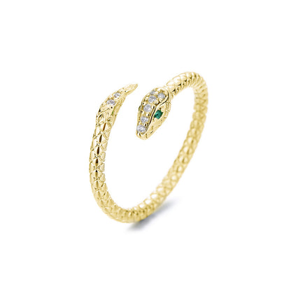 Gold-tone snake wrap ring with green eye and clear stones, open view