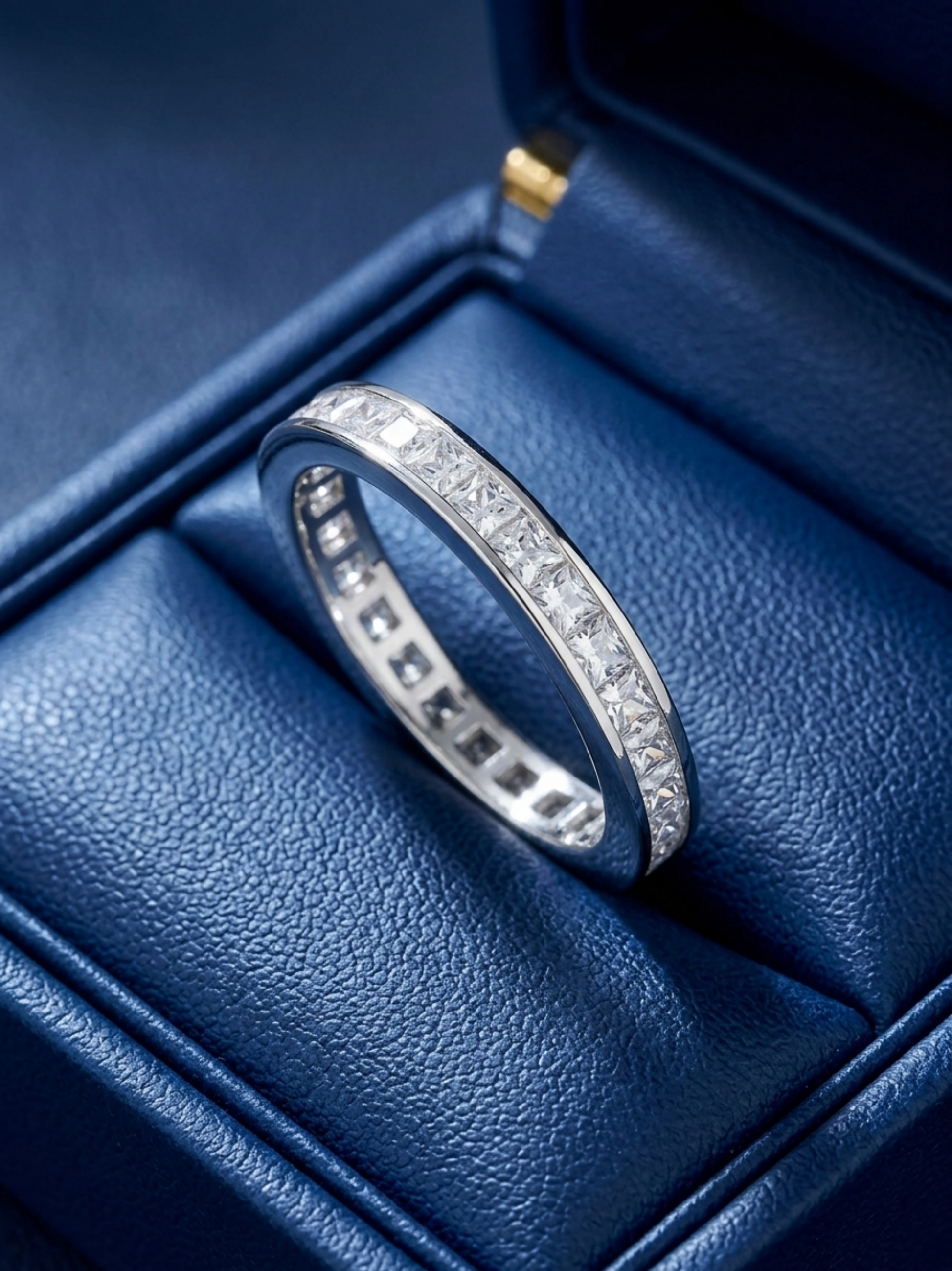 Princess Eternity Ring close-up: stacked princess-cut stones on a silver band
