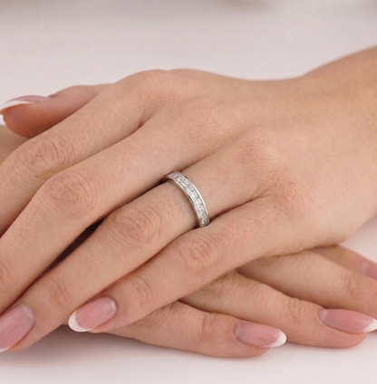 Princess Eternity Ring on hand: thin silver band with princess-cut stone detail
