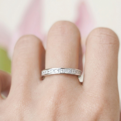 Princess Eternity Ring on finger: silver-tone band with princess-cut stones