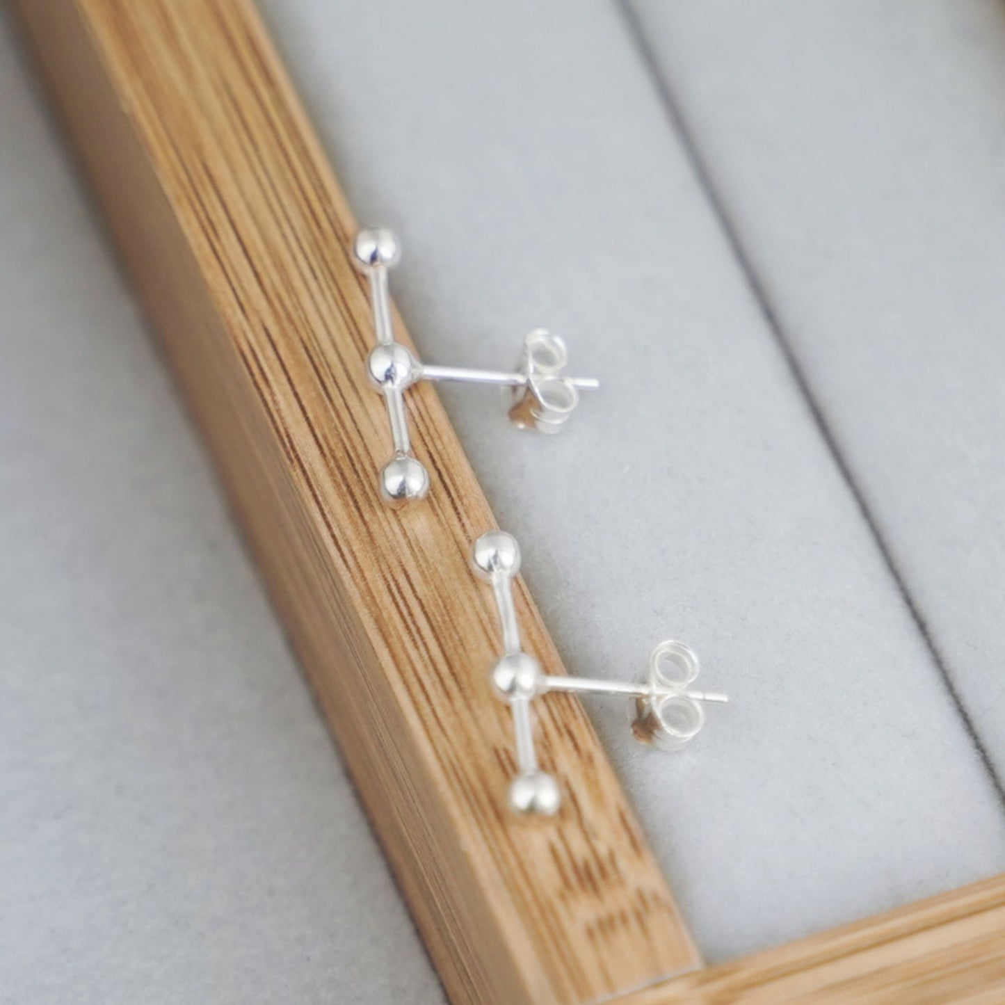 925 Sterling Silver Ball Stud Earrings with Triple Beads and Geometry Line - sugarkittenlondon