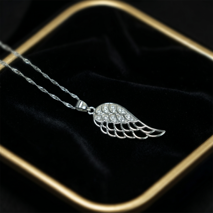 Angel wing pendant with pavé detailing and a silver-tone chain link
