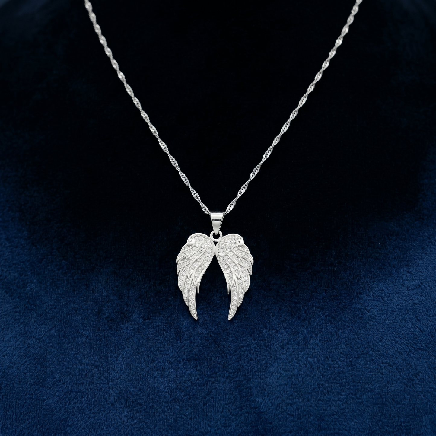 Double angel wing necklace pendant with pavé stones on a thin chain