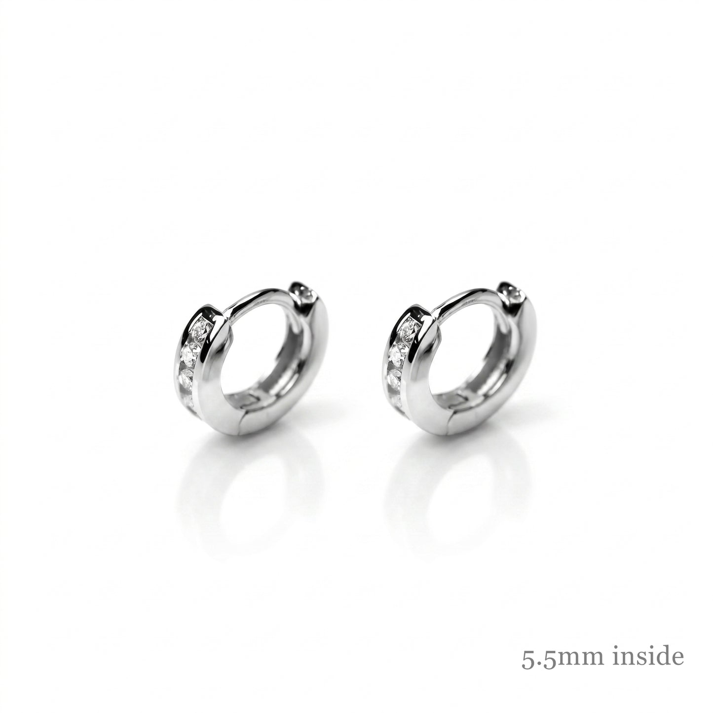 Channel Huggie Hoops in rhodium silver, rounded hoops with clear stone accents