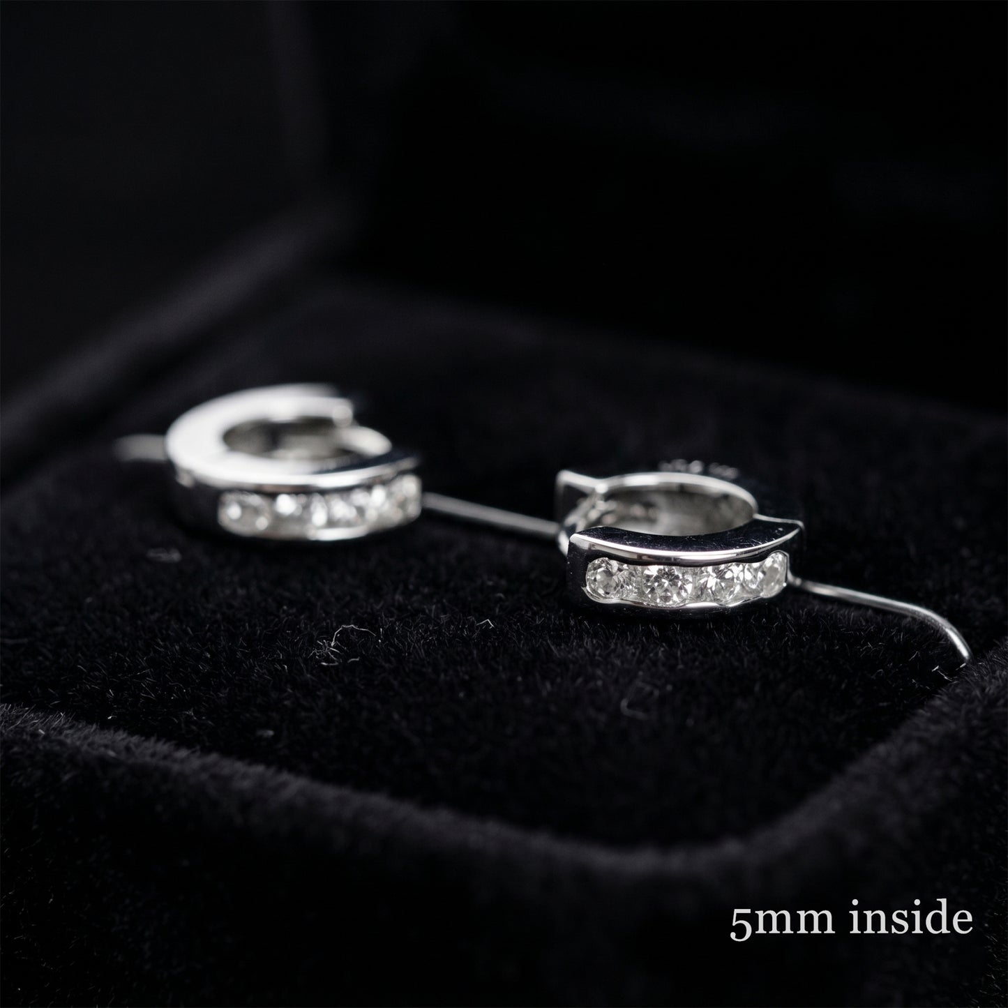 Rhodium Channel Huggie Hoops pair, curved bands with clear stones