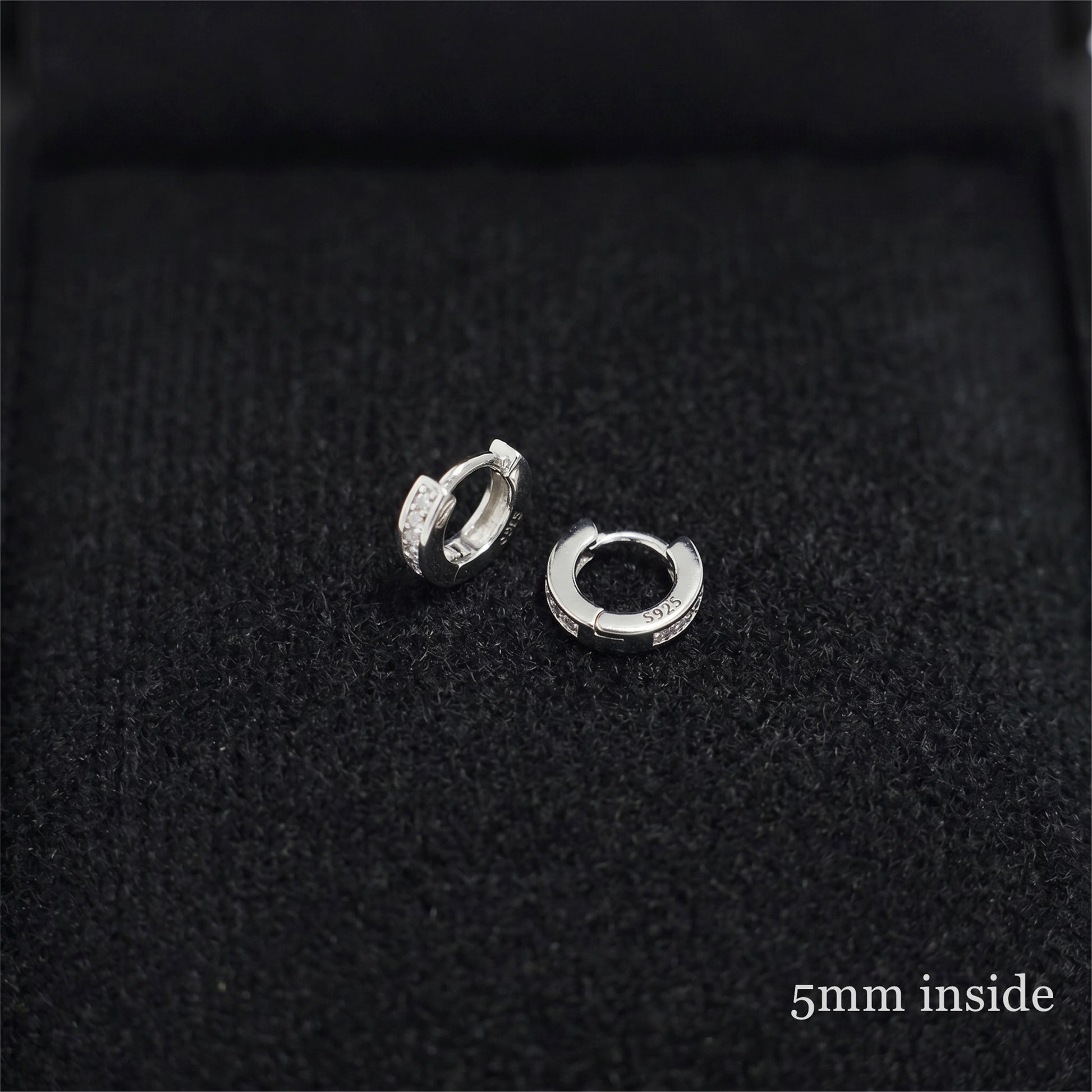 Rhodium Channel Huggie Hoops inner view: oval hoop with clear stone row