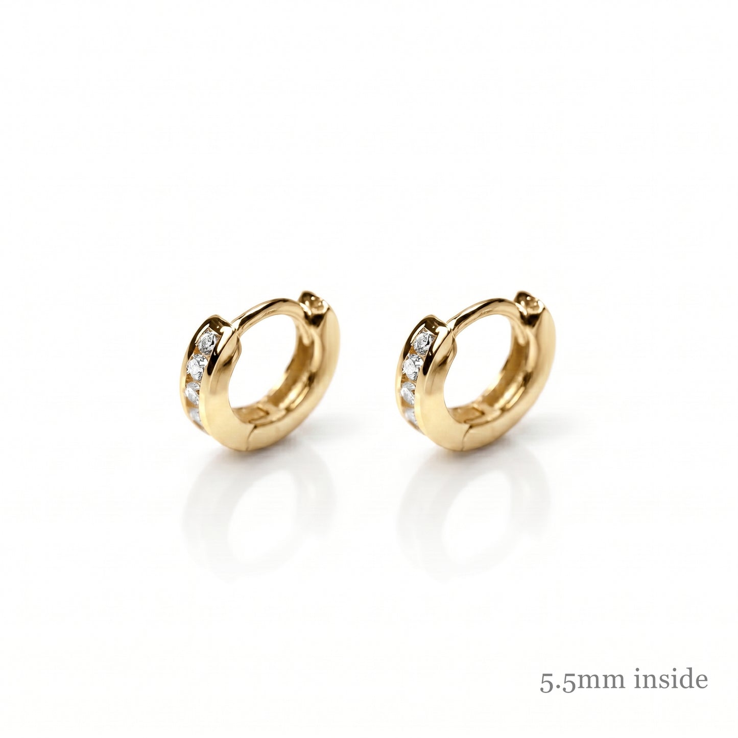 Gold Channel Huggie Hoops with clear stones, warm yellow metal hoops