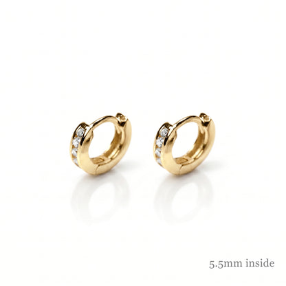 Gold Channel Huggie Hoops with clear stones, warm yellow metal hoops