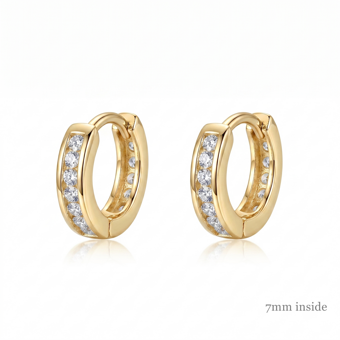 Channel Huggie Hoop earrings, gold tone with clear stone row; 7mm inside