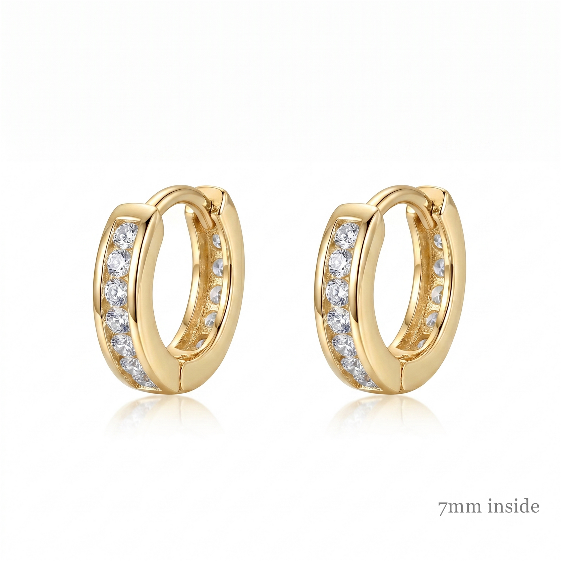 Channel Huggie Hoop earrings, gold tone with clear stone row; 7mm inside