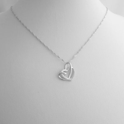 Sterling Silver Love Knot Necklace with Floating Sandblasted Heart Charm - sugarkittenlondon