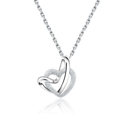 Sterling Silver Love Knot Necklace with Floating Sandblasted Heart Charm - sugarkittenlondon