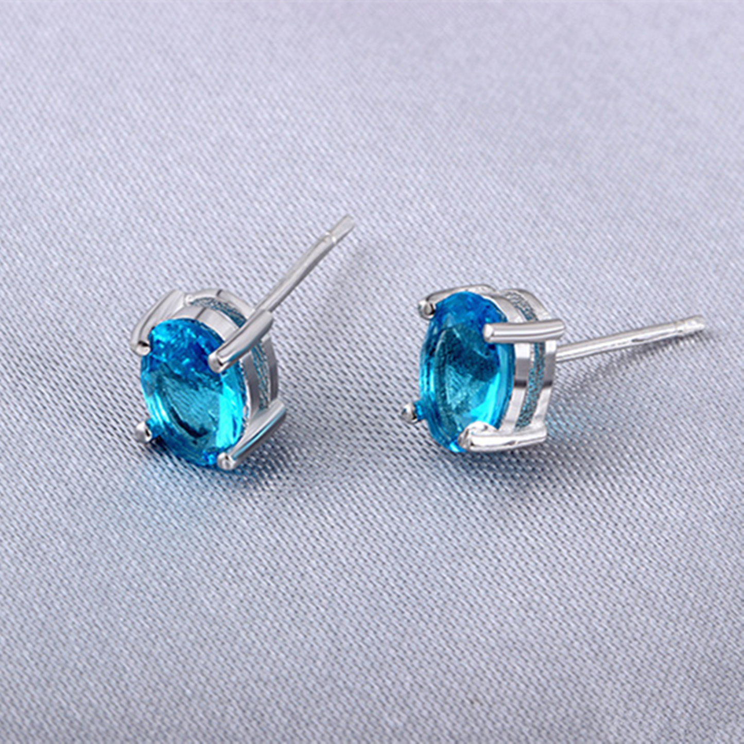 925 Sterling Silver Solitaire Blue Oval Cut CZ Stud Earrings - sugarkittenlondon